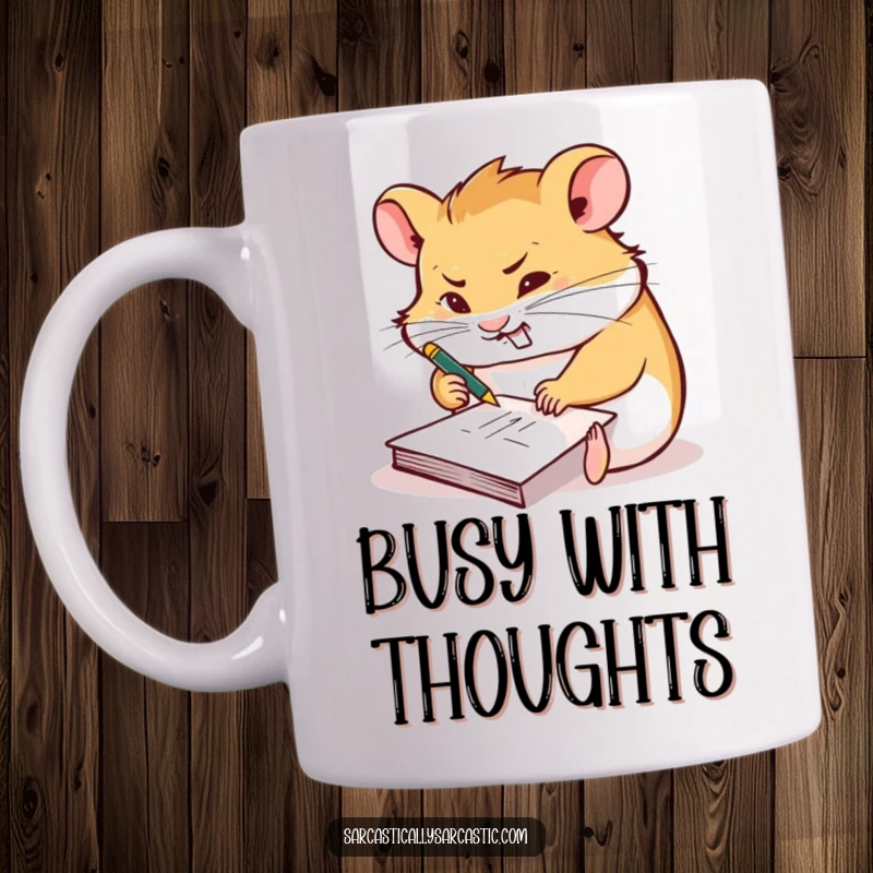 Funny mug showing a hamster furiously scribbling on a tiny notepad with a smirk, representing busy creativity.