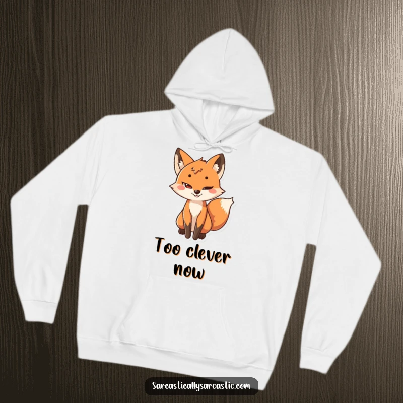 Funny hoodie depicting a playful fox with a sly grin and its tail subtly wagging, embodying cleverness.
