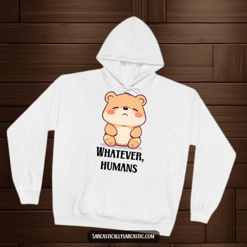 Funny bear hoodie showing a bear shrugging its shoulders with a faint, unimpressed smirk. Cozy and humorous.