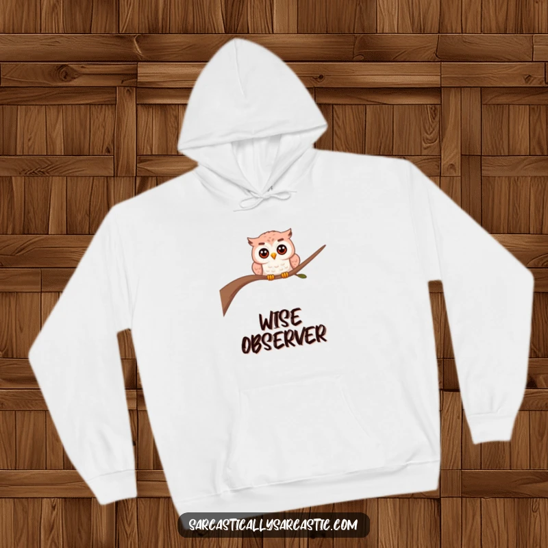 Funny owl hoodie featuring a soft, warm feel and a curious owl peeking from behind a branch, looking mysterious.