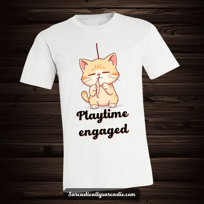 Funny cat t-shirt showing a cat with narrowed eyes, intensely batting at a dangling string, a funny gift.