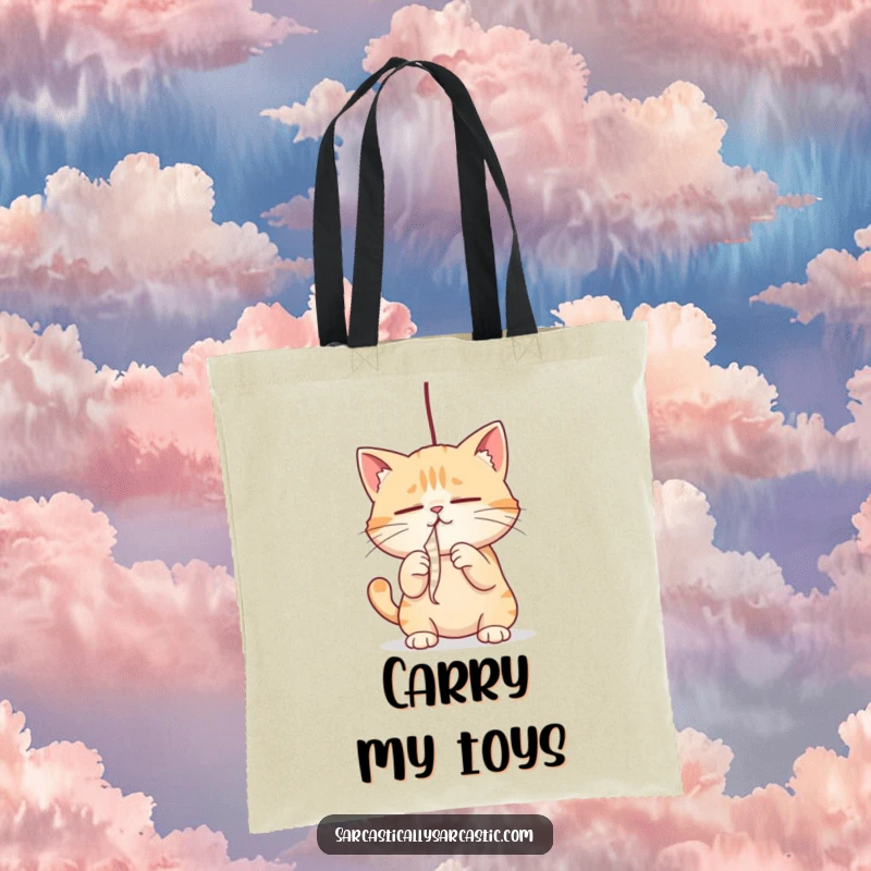 Funny cat tote bag with a cat intensely batting a dangling string, perfect for a stylish and funny gift.